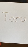 仲村製に似た点字盤で、ローマ字でToruと書いていただきました